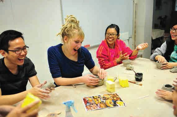 A foreign student shares a laugh with local students